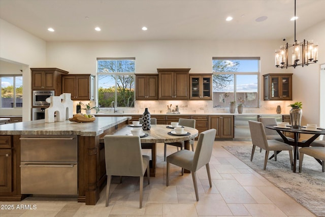 8599 E Sand Flower Dr, Scottsdale, AZ 85266 - kitchen featuring stainless steel microwave, decorative backsplash, and recessed lighting