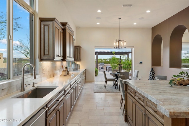 8599 E Sand Flower Dr, Scottsdale, AZ 85266 - kitchen with a wealth of natural light, visible vents, a sink, and recessed lighting