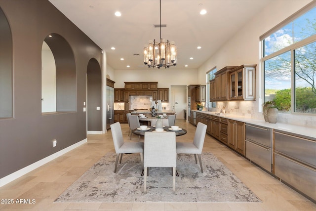 8599 E Sand Flower Dr, Scottsdale, AZ 85266 - dining area featuring recessed lighting, a chandelier, and a healthy amount of sunlight