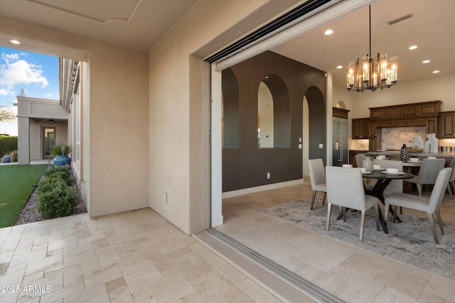 8599 E Sand Flower Dr, Scottsdale, AZ 85266 - dining room with recessed lighting, stone finish floor, visible vents, and an inviting chandelier