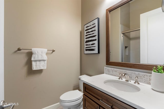 8599 E Sand Flower Dr, Scottsdale, AZ 85266 - bathroom featuring baseboards, a shower stall, toilet, and vanity