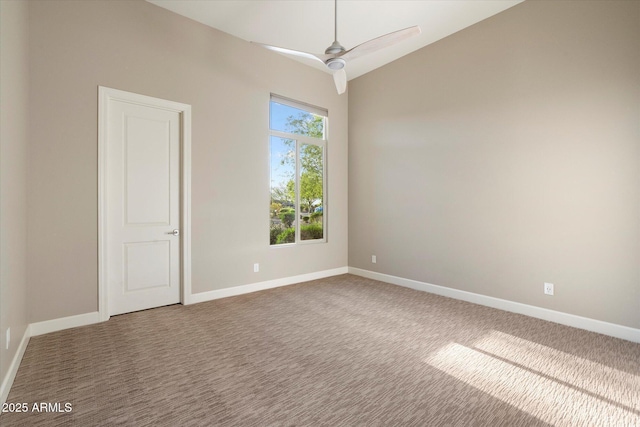 8599 E Sand Flower Dr, Scottsdale, AZ 85266 - spare room featuring lofted ceiling, a ceiling fan, carpet floors, and baseboards