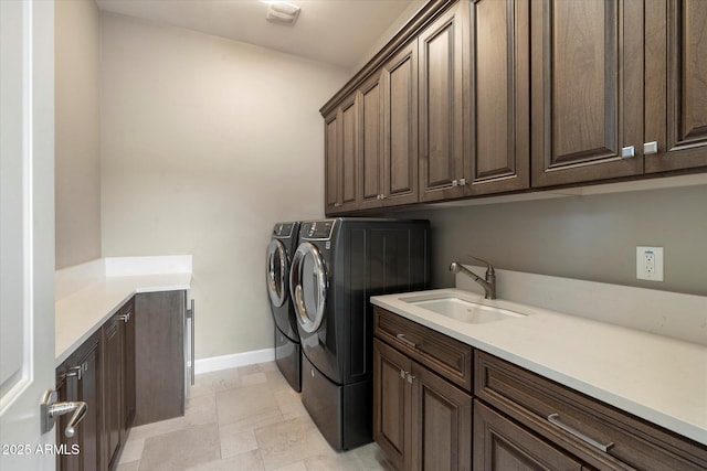 8599 E Sand Flower Dr, Scottsdale, AZ 85266 - washroom with cabinet space, washer and clothes dryer, baseboards, and a sink