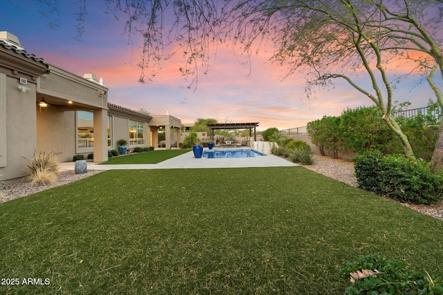 8599 E Sand Flower Dr, Scottsdale, AZ 85266 - yard at dusk with a pergola, a fenced backyard, a fenced in pool, and a patio area