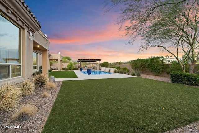 8599 E Sand Flower Dr, Scottsdale, AZ 85266 - yard at dusk with a pergola, a fenced backyard, a fenced in pool, and a patio area