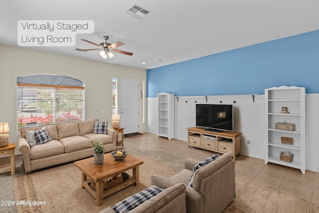 tiled living room featuring ceiling fan