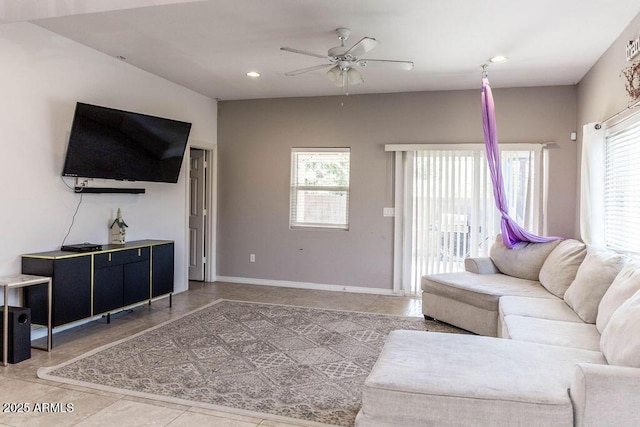 living room featuring a ceiling fan, tile patterned floors, recessed lighting, and baseboards