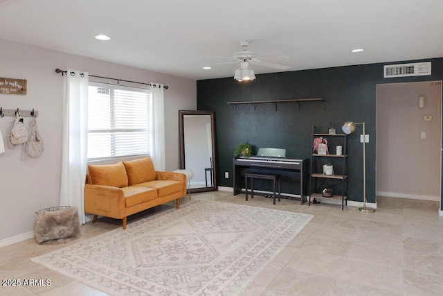 living area with ceiling fan, an accent wall, recessed lighting, baseboards, and visible vents