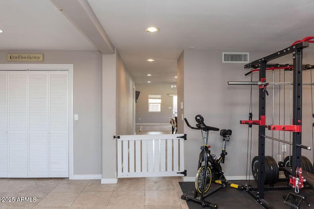 exercise area featuring baseboards, tile patterned floors, recessed lighting, and visible vents