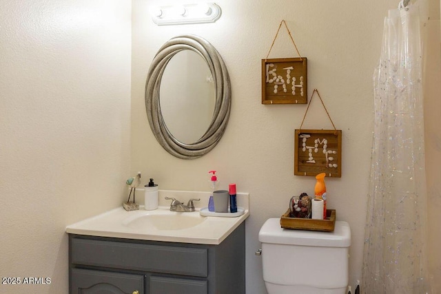 full bath with vanity and toilet