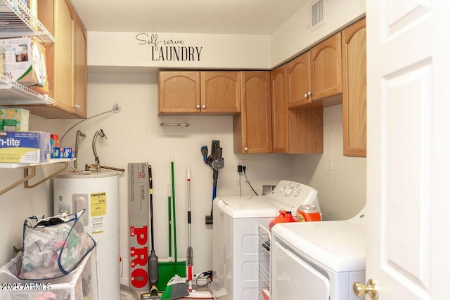 clothes washing area with visible vents, washing machine and dryer, cabinet space, and electric water heater