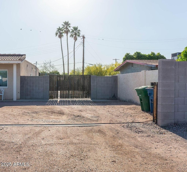 view of gate with fence