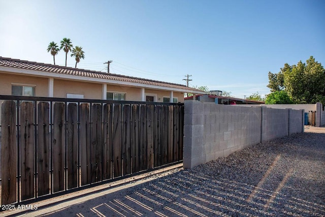 view of gate with fence
