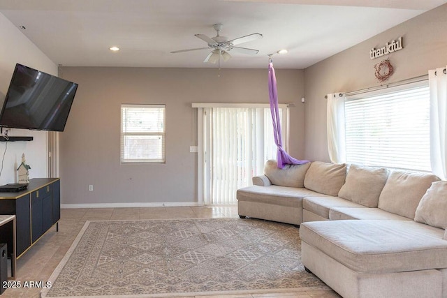 living room with a ceiling fan, baseboards, recessed lighting, and light tile patterned floors