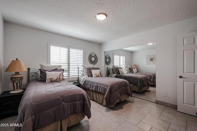 bedroom featuring a textured ceiling