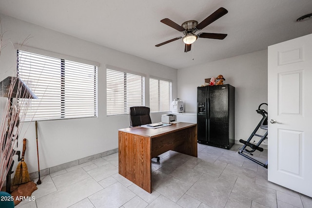 office area with visible vents, ceiling fan, baseboards, and light tile patterned floors