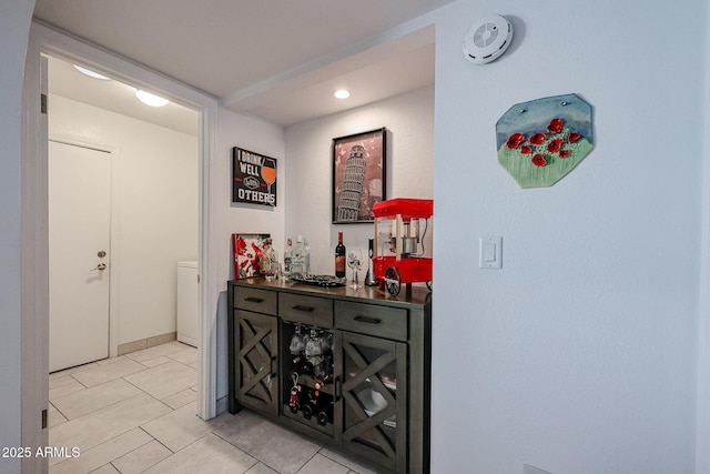 hallway featuring light tile patterned floors