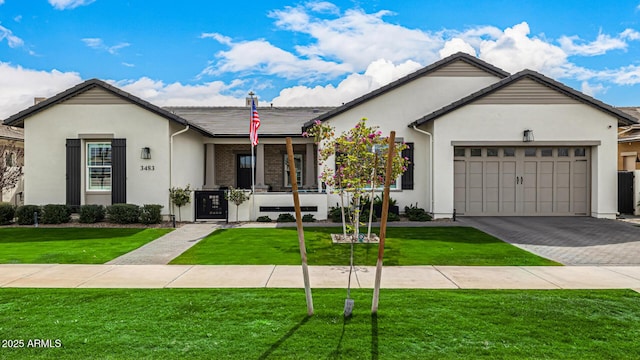 ranch-style house featuring a porch, a front yard, stucco siding, decorative driveway, and a garage