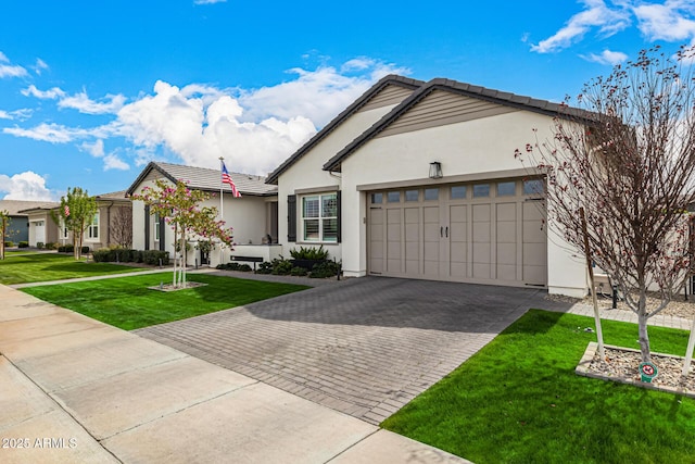 single story home featuring a front yard, stucco siding, a garage, a tiled roof, and decorative driveway