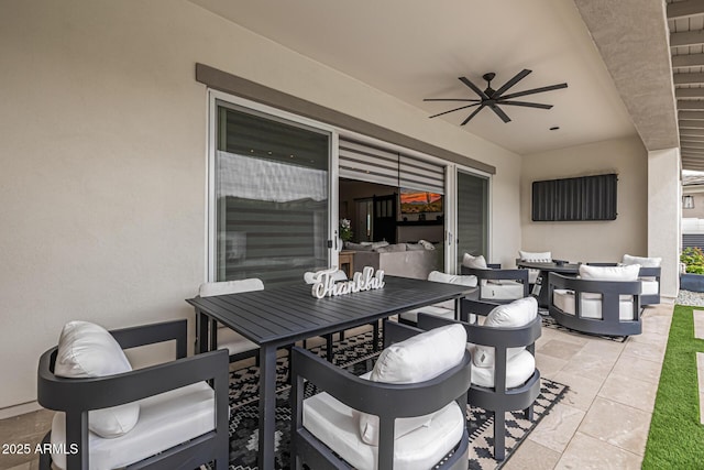 view of patio / terrace with outdoor dining area and ceiling fan