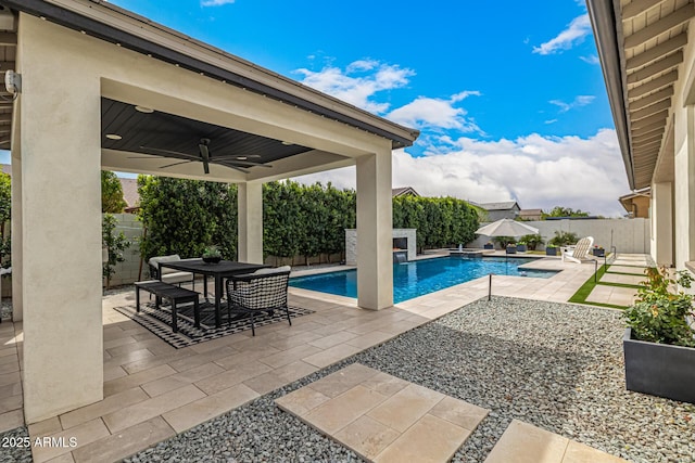 view of pool featuring outdoor dining space, a ceiling fan, a fenced in pool, a fenced backyard, and a patio area