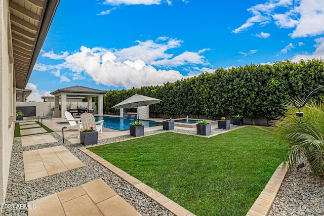 view of yard featuring area for grilling, a fenced backyard, a gazebo, a fenced in pool, and a patio area