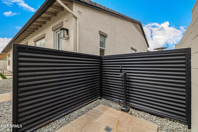 view of gate featuring fence