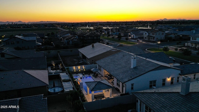 aerial view at dusk with a residential view