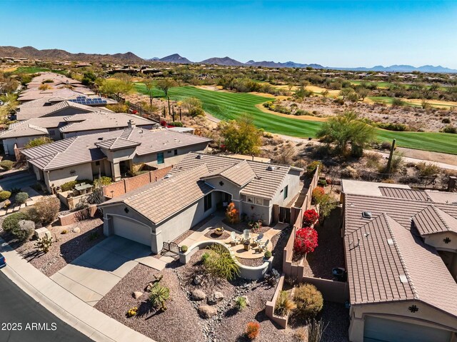 birds eye view of property featuring a mountain view