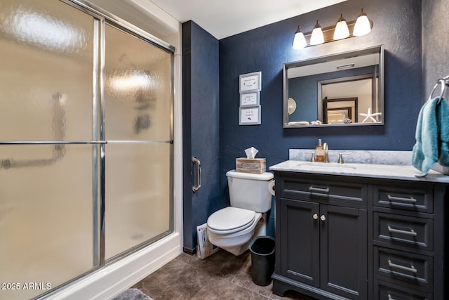 bathroom featuring walk in shower, tile patterned floors, vanity, and toilet