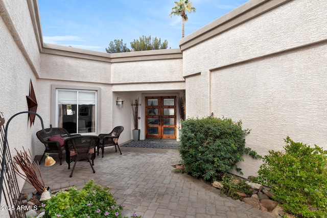 doorway to property with a patio and french doors