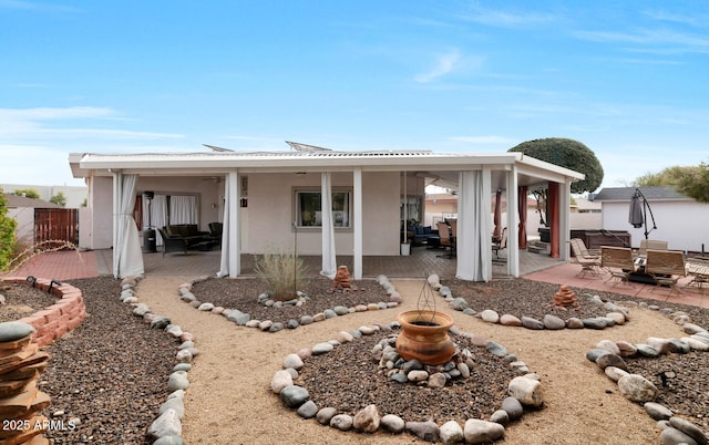 back of house with a patio area