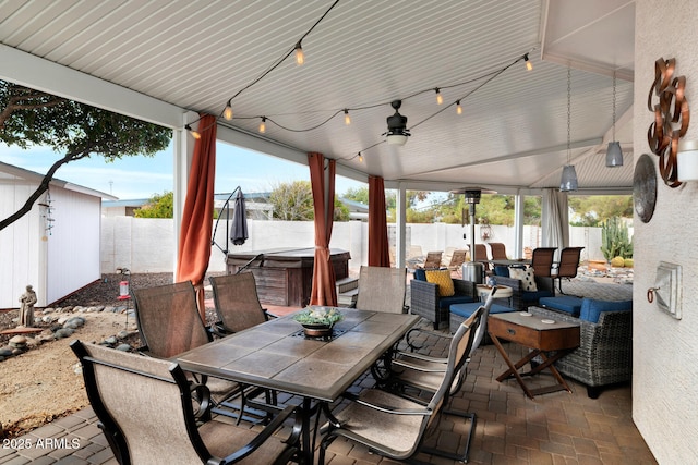 view of patio / terrace with a hot tub and ceiling fan