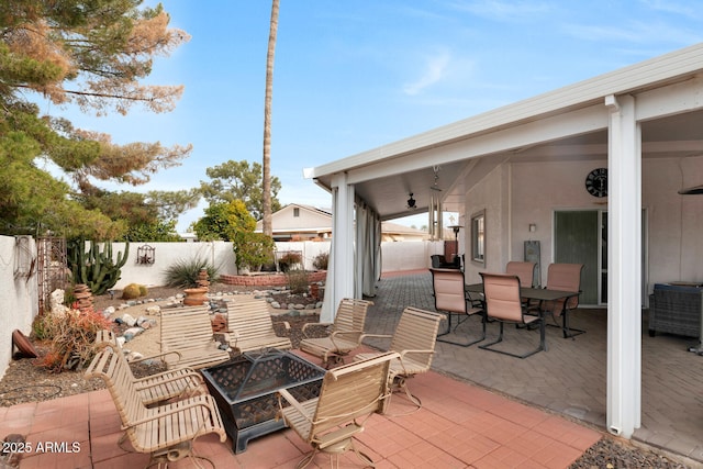 view of patio featuring an outdoor fire pit