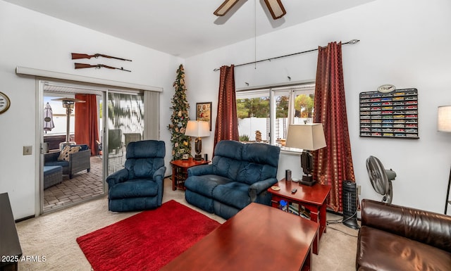 carpeted living room with plenty of natural light and ceiling fan