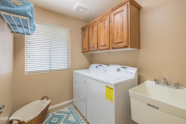 11320 E Newcastle Ave, Mesa, AZ 85209 - laundry room with washer and clothes dryer, cabinet space, and baseboards