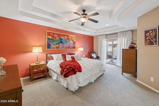 11320 E Newcastle Ave, Mesa, AZ 85209 - carpeted bedroom featuring a tray ceiling, access to exterior, baseboards, and a ceiling fan