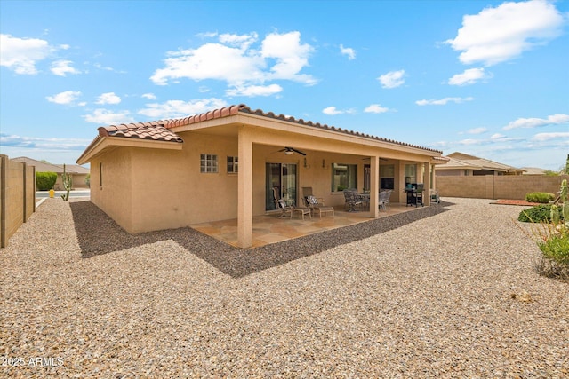 11320 E Newcastle Ave, Mesa, AZ 85209 - back of property with stucco siding, a tile roof, ceiling fan, a fenced backyard, and a patio area