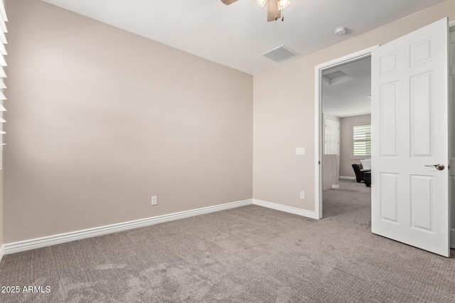 unfurnished bedroom featuring carpet floors, baseboards, and ceiling fan