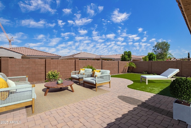 view of patio with a fenced backyard and an outdoor hangout area