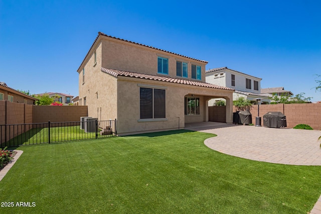 rear view of property featuring stucco siding, a patio area, a tile roof, and cooling unit