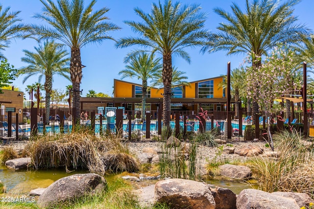 surrounding community featuring fence and a pool