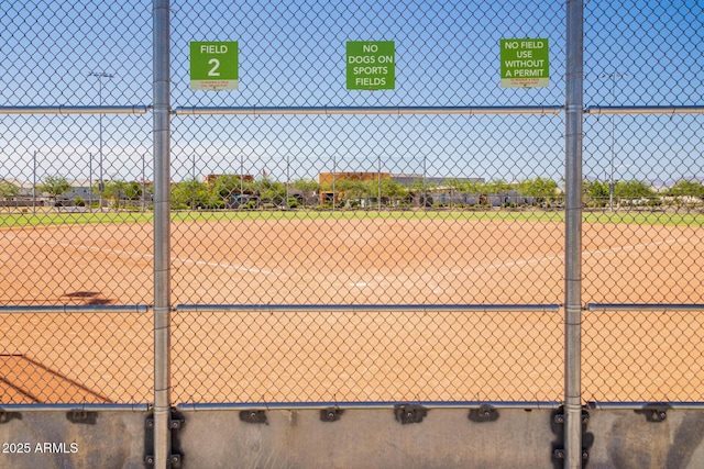 view of community featuring fence