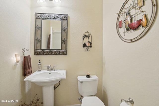 bathroom featuring toilet