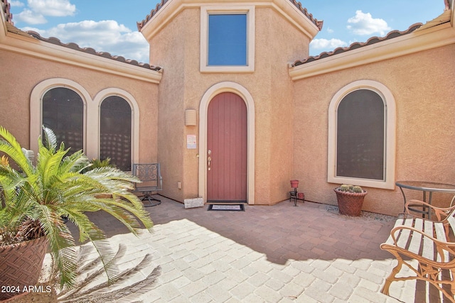 property entrance with a patio