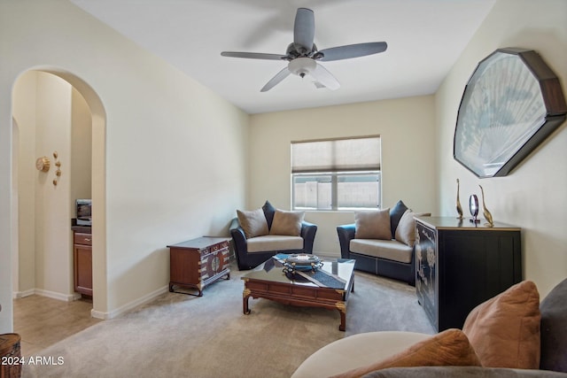 living room featuring ceiling fan and light carpet