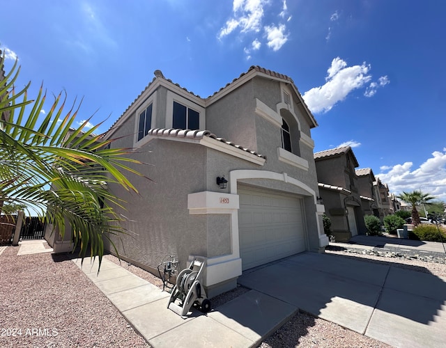 view of side of property featuring a garage