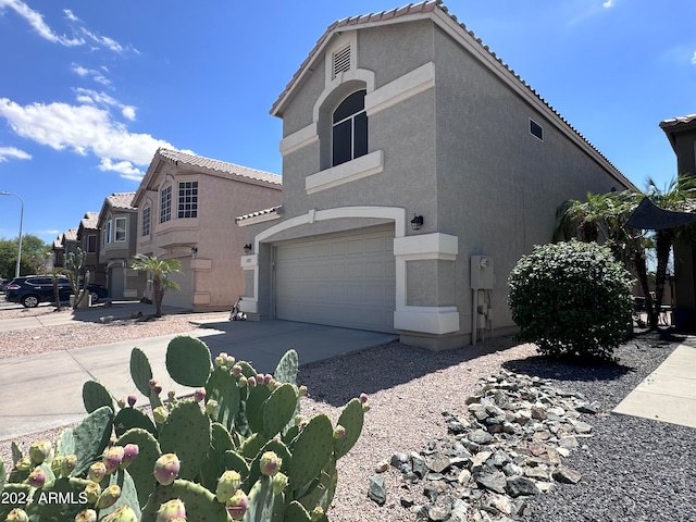 view of side of property with a garage