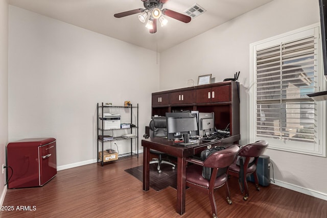office with a ceiling fan, wood finished floors, and baseboards