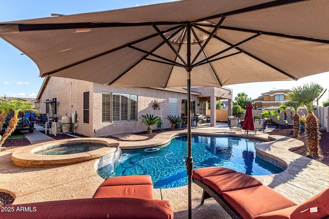 view of pool with a patio, a pool with connected hot tub, and fence